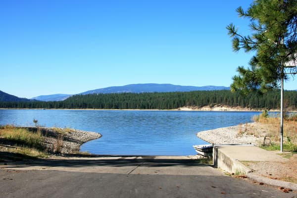 boat launch leading into blue lake water - NPS Photo