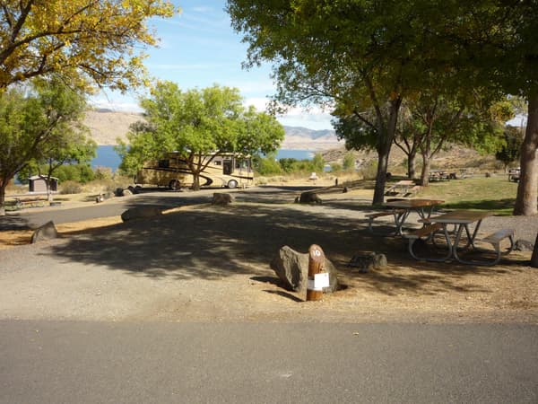 A view of paved access roads and campsites, overlooking the lake. - NPS Photo