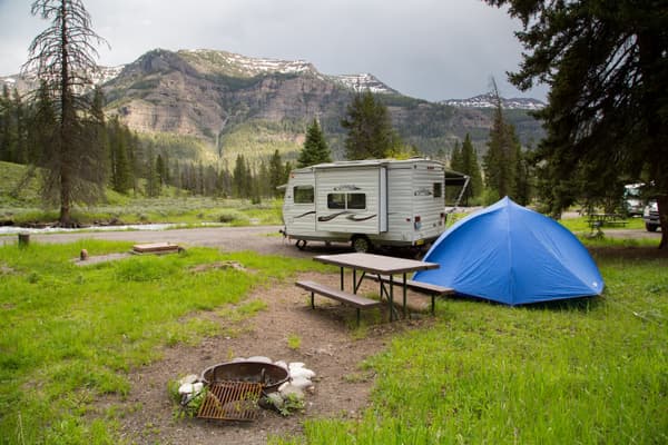 Tent and camper at campsite. - NPS / Neal Herbert