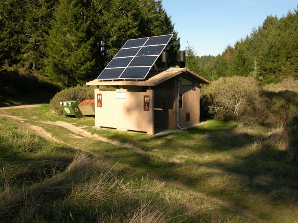 Sky Campground vault toilets with photovoltaic panels on the roof. - NPS Photo