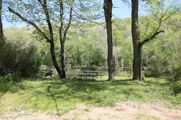 A picnic table right along the water's edge. - NPS Photo / Wil Marischen
