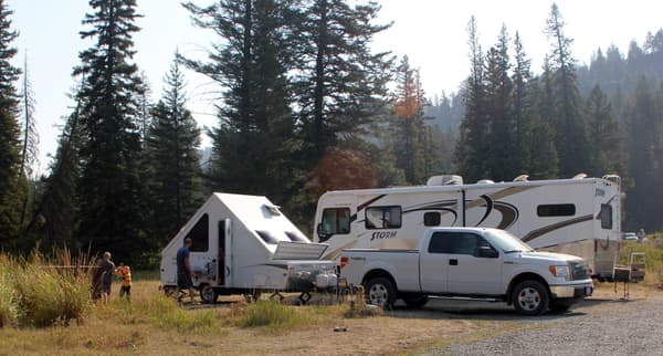 Truck with camping trailer, RV at campsite - NPS